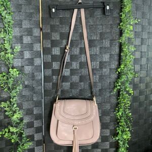 Franco Sarto bag lavender with gold buttons and tassel on the front